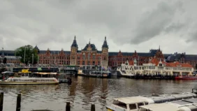 amsterdam the netherlands station city of tulips and dancing houses along the canal belts {{brizy_dc_image_alt imageSrc=